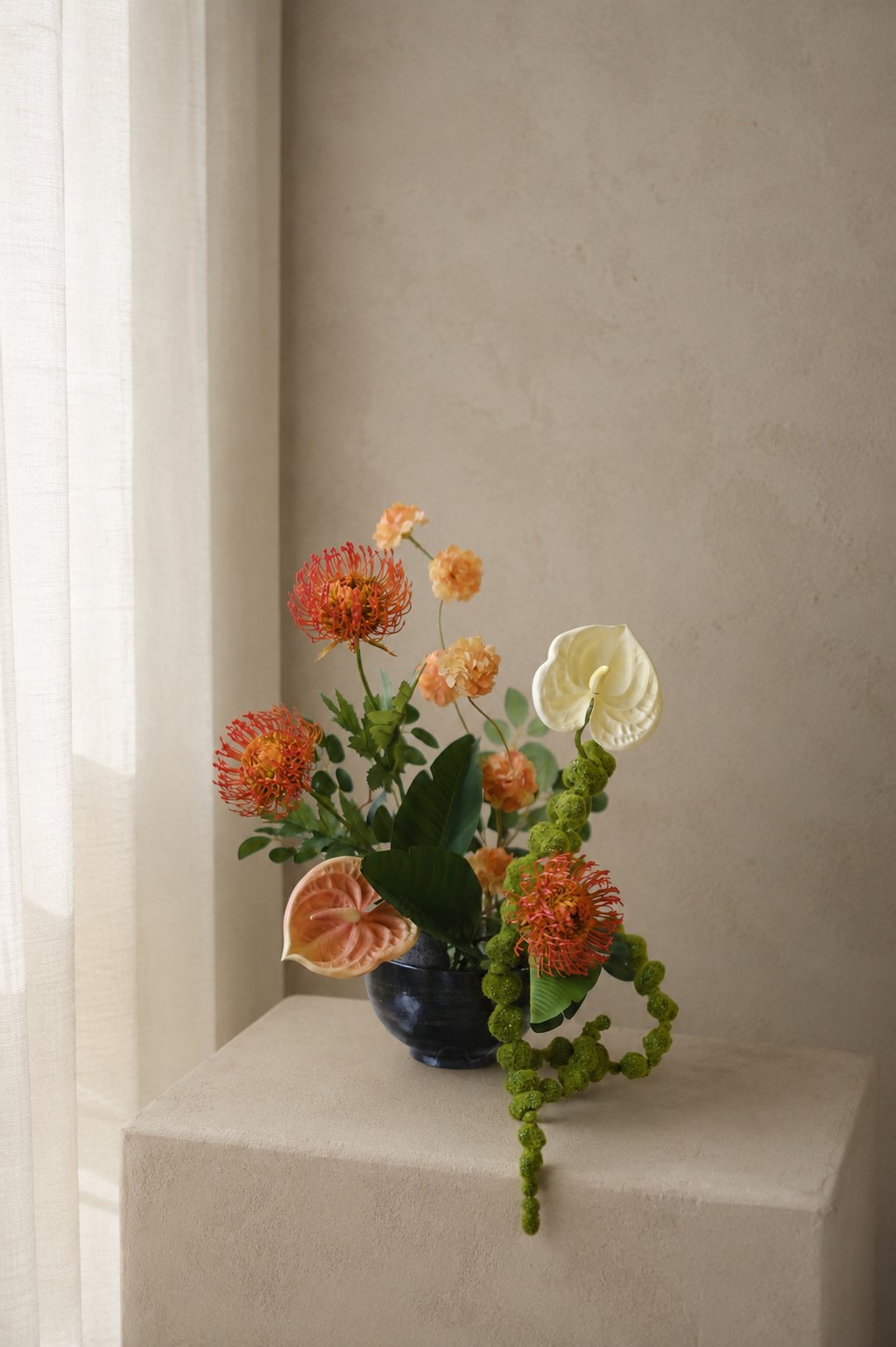 Warm orange sculptural floral arrangement for home styling