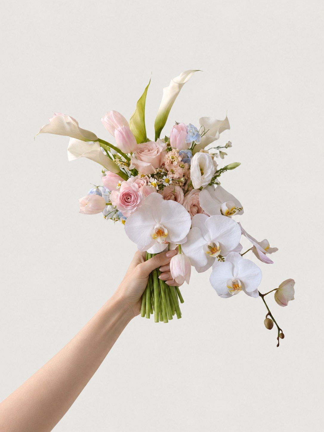 Blush and ivory orchid cascade wedding bouquet held by hand by Anelia Fleur Singapore